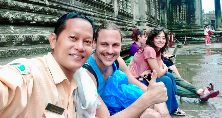 Guide and travelers at Angkor Wat