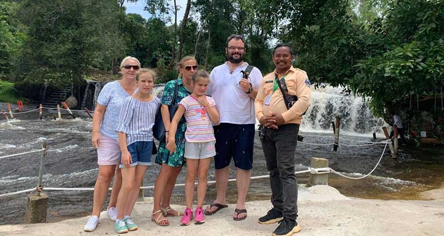 Travelers at Waterfall