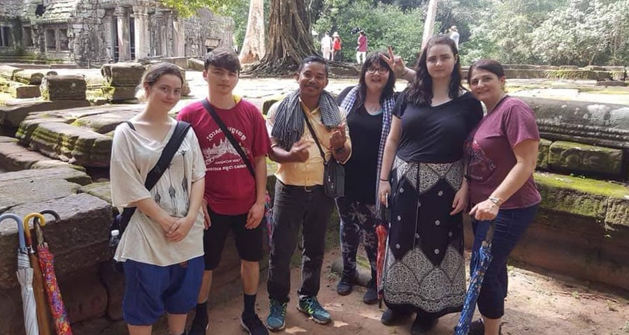 Mr. Chanra and travelers at temple